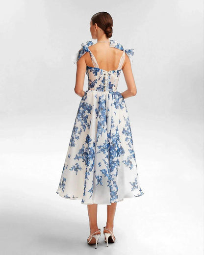 Romantic Midi Dress with Floral Embroidery and Bow Details
