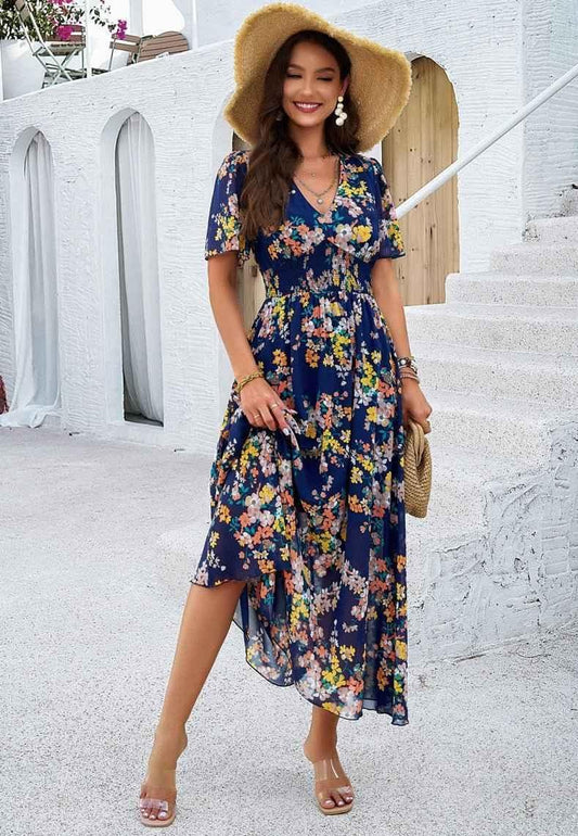 Boho maxi dress with floral print, V-neckline, and smocked waist